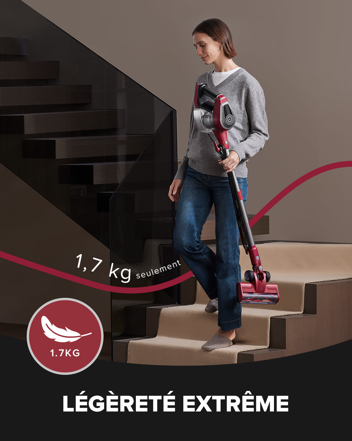 Woman carrying a lightweight vacuum cleaner up stairs with text 'Just 1.7kg' 